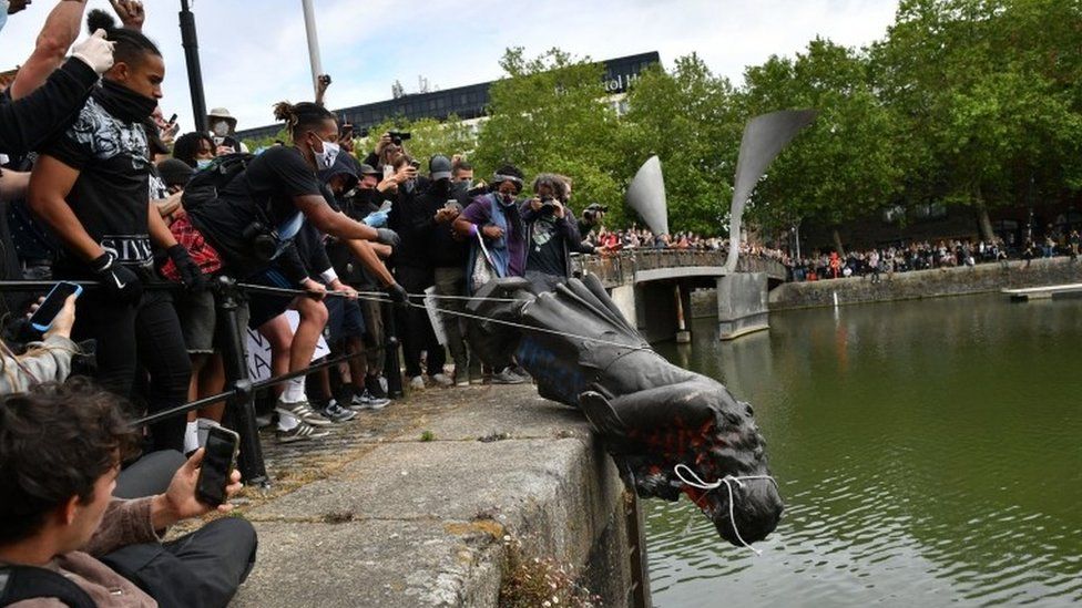 London statues: Edward Colston statue toppled by protestors in Bristol harbour, 2020. BBC.