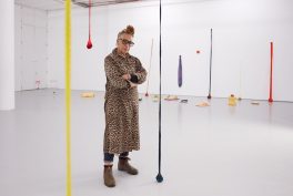 Portrait of Veronica Ryan with her exhibition, Along a Spectrum, 2021, Spike Island, Bristol, UK. 